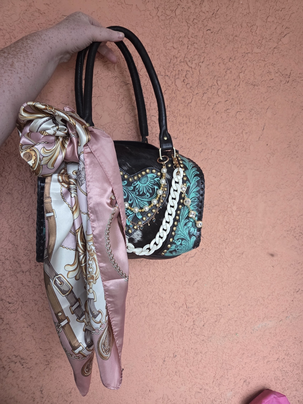 Black Handheld Bag with Teal Floral Embroidery and Pink Scarf
